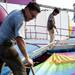 Juan Carlos and Leonardo clean a ride for the Jaycees' Carnival on Tuesday, June 25. Daniel Brenner I AnnArbor.com